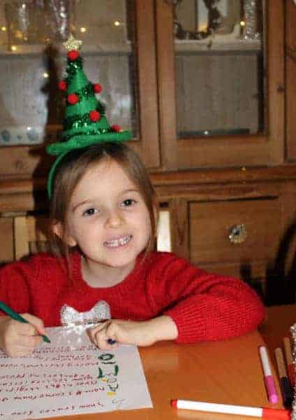 Little girl writing poem