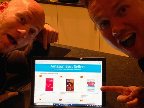 Rick and Tommy showing Pain the Arts Book as Amazon Best Seller